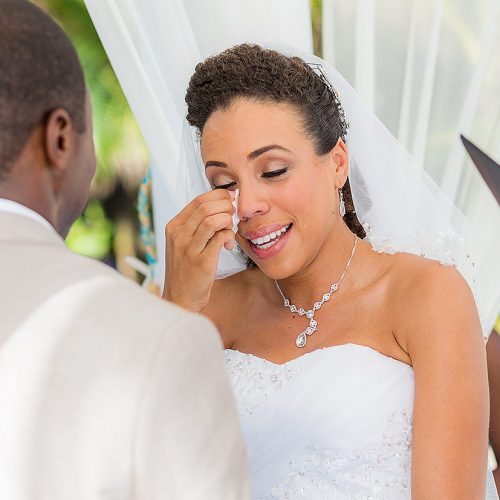 Bride crying at wedding ceremony