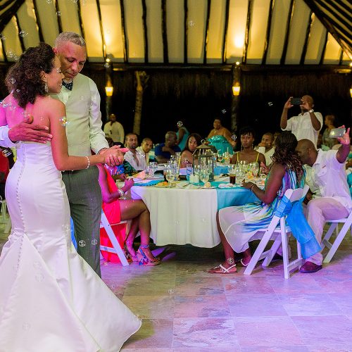 Bride dancing with father at El Dorado Seaside Suites wedding reception