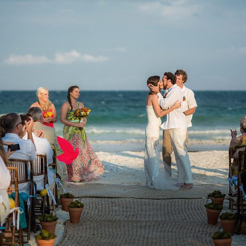 Bride and Grooms first kiss at wedding in Tulum