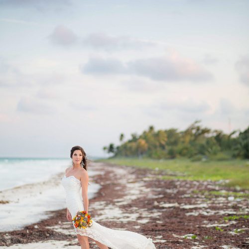 Bride on beach in Tulum wedding
