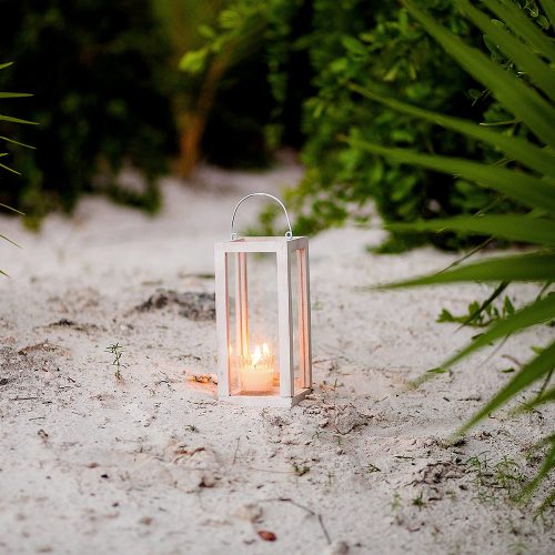 Candles on sand at wedding in Tulum