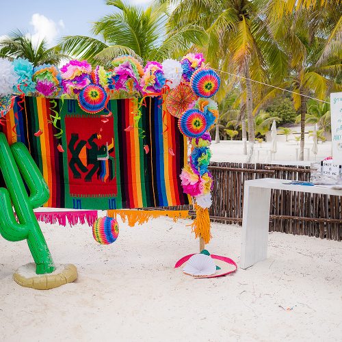 Mexican themed photo booth on beach at Hacienda Paraiso