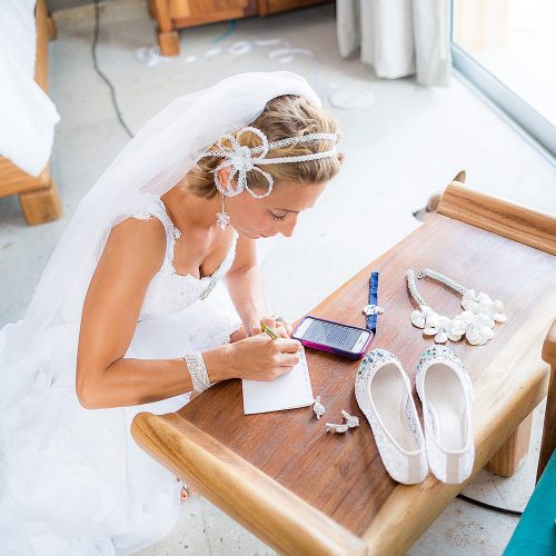 Bride writing vows before wedding