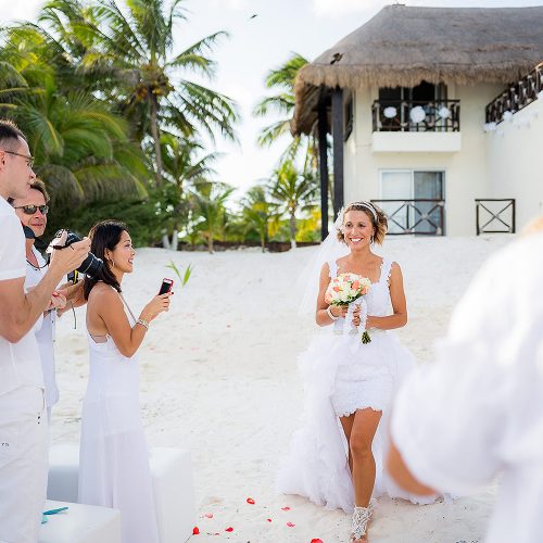 Bride walking down sand aisle are Hacienda Paraiso, Tulm