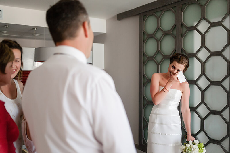 Bride crying when seeing father for the first time. 