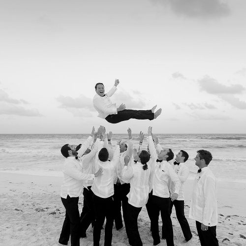 Groom toss at Hard Rock Cancun beach wedding