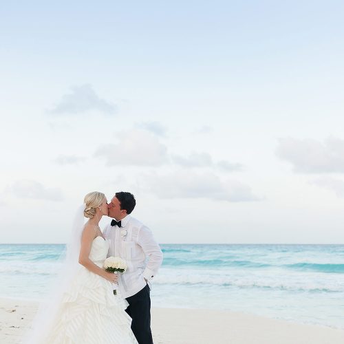 Couple kissing at Hard Rock Cancun beach