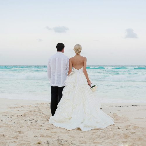 Couple looking at the ocean at Hard Rock Cancun Beach