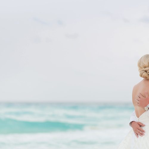 Couple kissing at the beach at Hard Rock Cancun beach wedding