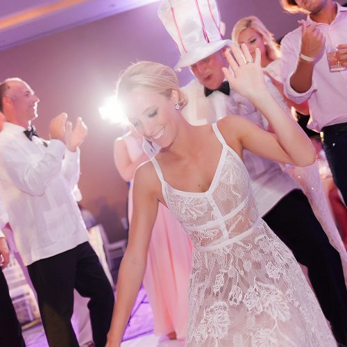 Bride dancing and having fun at her Hard Rock Cancun Wedding reception
