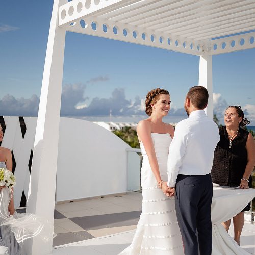 Bride and groom at wedding ceremony at Azul Fives Hotel, Riviera Maya