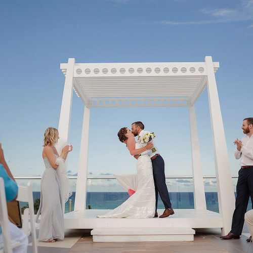 Bride and grooms first kiss at Azul Fives Sky Deck