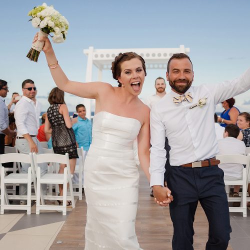 Bride and groom celebrating after ceremony at Azul Fives Hotel, Riviera Maya