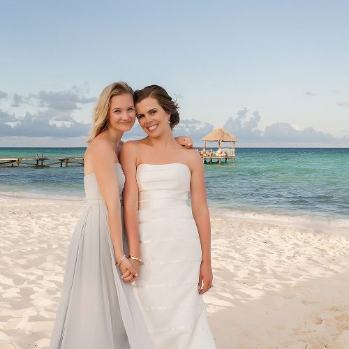 Bride and bridesmaid on beach at Azul Fives Hotel, Riviera Maya