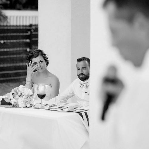 Bride crying during speech at wedding.