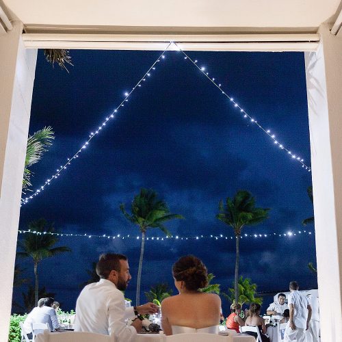 Bride and groom at sweatheart table at Azul Fives Hotel, Riviera Maya