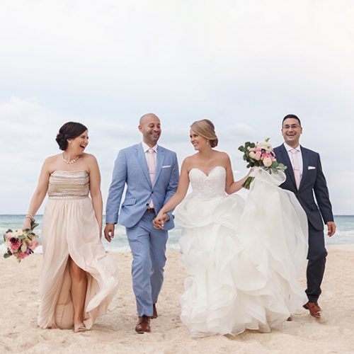 Bridal party walking on beach at Azul Fives Hotel, Riviera Maya