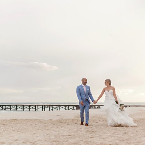 Bride and groom on beach at Azul Fives Hotel, Riviera Maya