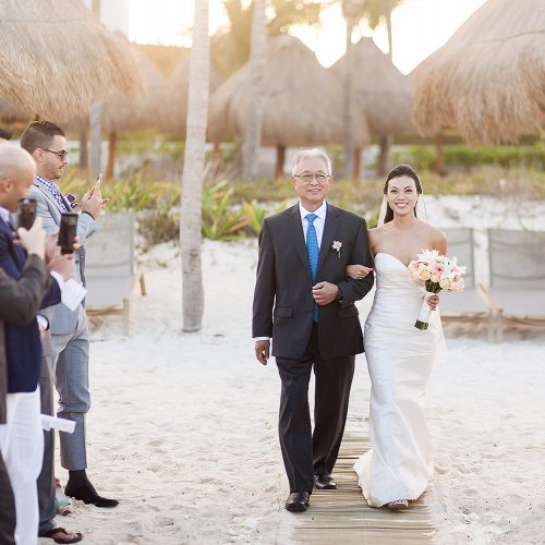 Bride walking down aisle to beach wedding in Cancun | Dean Sanderson Weddings