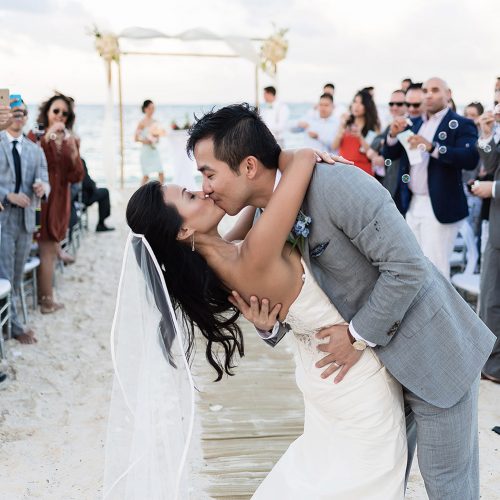Bride and groom kissing after ceremony in Cancun
