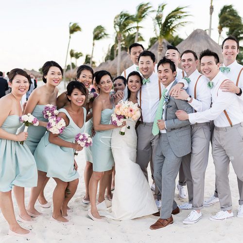 Fun portrait of bridal party shortly after wedding ceremony in Cancun