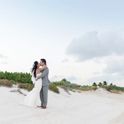 Bride and groom portrait on beach in Cancun