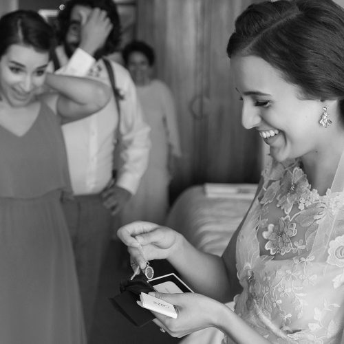 Bride opening gift before wedding at el Paraiso Tulum