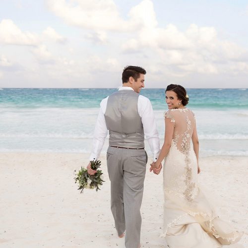 Bride and groom on beach in Tulum