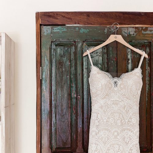 Dress and flowers hanging before wedding in Tulum