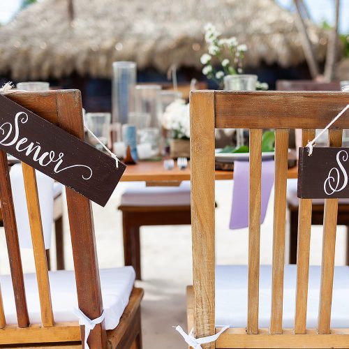 Bride and grooms chairs at wedding reception