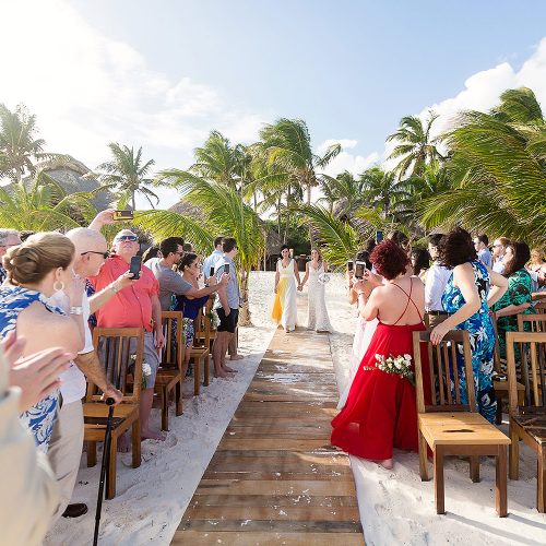Bride walking down aisle at Akiin wedding in Tulum