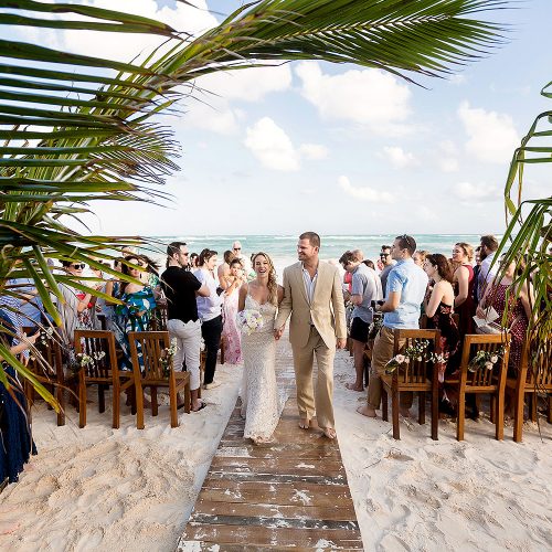 Bride and groom after beach wedding ceremony at Akiin, Tulum