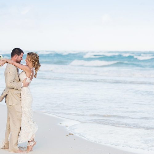 Bride and groom on beach in Tulum