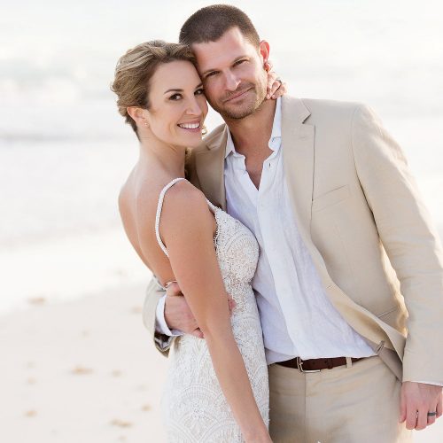 Portrait of bride and groom on beach in Tulum
