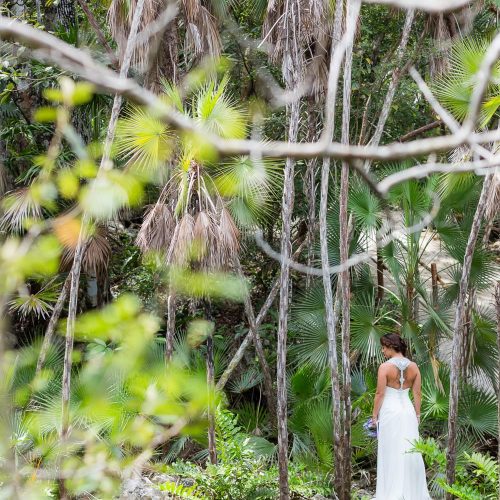 Bride standing at the entrance of Mayan Cenote at Riviera Maya