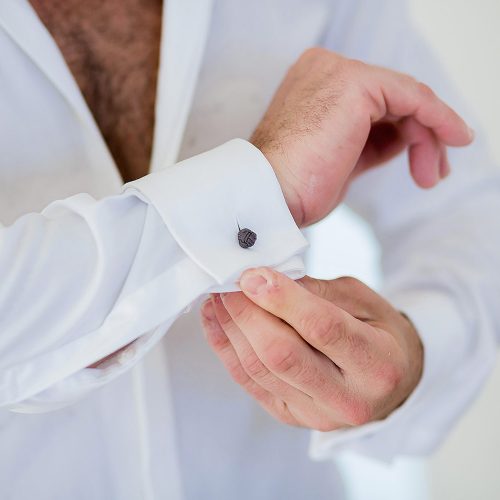 Close up of grooms cuff links.