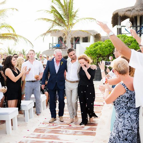 Groom walking down the aisle at Riviera Maya wedding