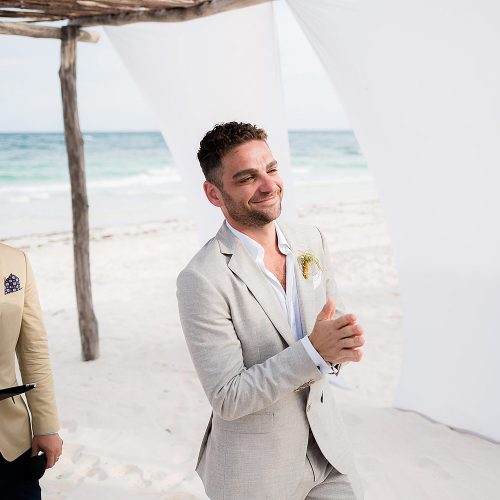 Groom waiting for bride to come down aisle