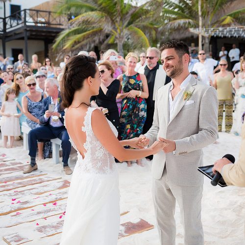 bride and groom on at wedding ceremony on beach in the Riviera Maya