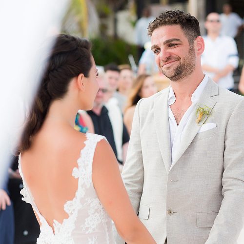 Groom looking at bride during vows