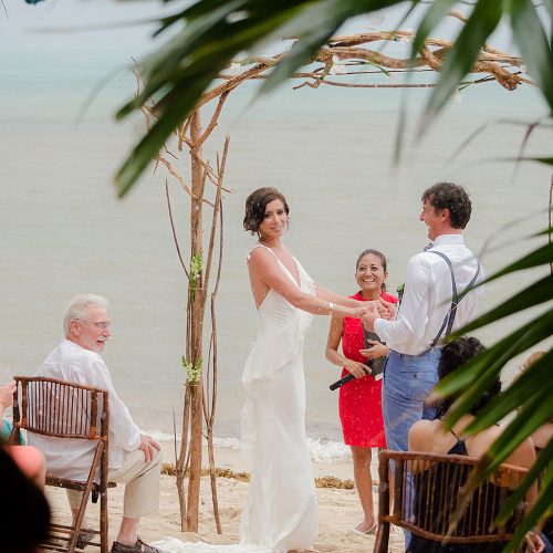 Bride and groom during ceremony in Tulum