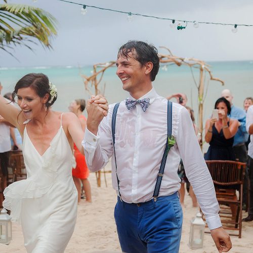 Bride and groom celebrate after wedding ceremony in Tulum