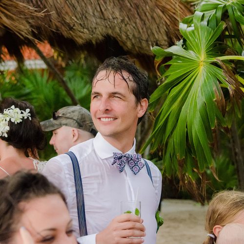 Groom soaking wet after wedding ceremony in Tulum