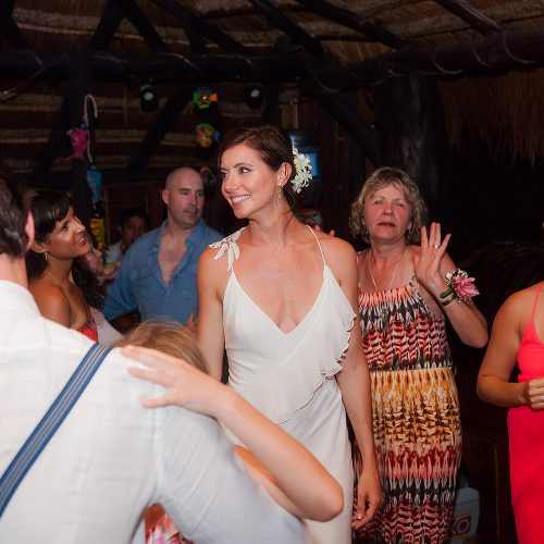 Bride dancing at her wedding reception in Tulum