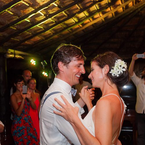 Bride and groom dancing at their wedding reception in Tulum