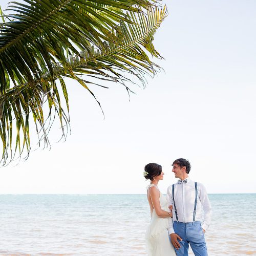 Bride and groom on beach in Tulum
