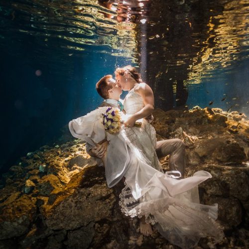 Bride and Groom kissing underwater in Trash the Dress, Riviera Maya