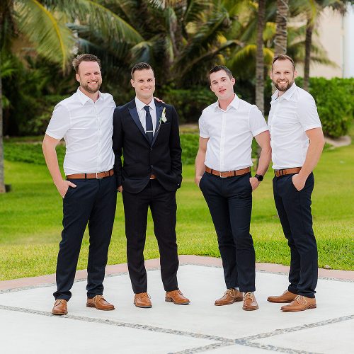 Portrait of groom with groomsmen in garden at NOW Jade Riviera Cancun resort
