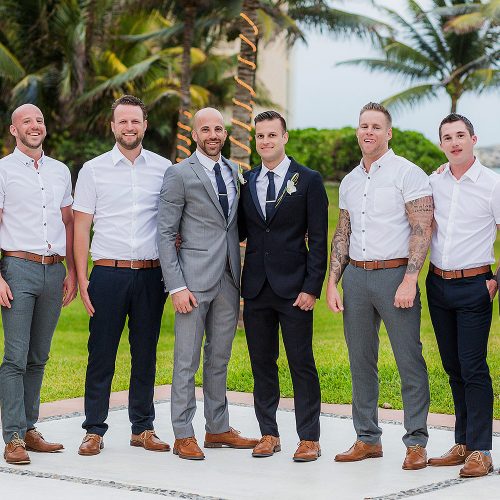 Grooms and bridal party at gay wedding