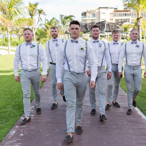 Groomsmen walking after wedding at Royalton Riviera Cancun